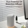 Yasser Booster white waterless aroma diffuser highlighting undiluted oils for a purer fragrance with an oil bottle on a desk