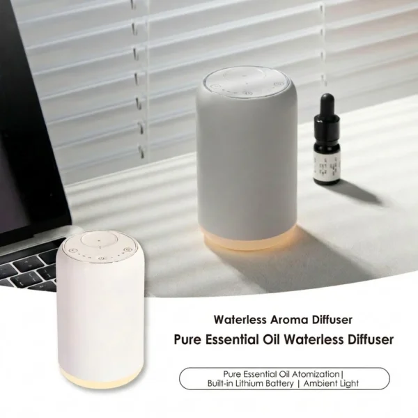 White wireless waterless essential oil diffuser with ambient warm light and an oil bottle placed on a modern desk
