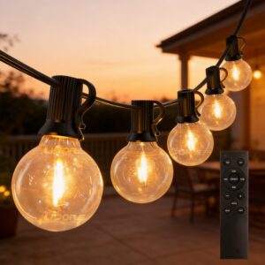 G40 Outdoor String Lights Sunset Patio Lifestyle Warm glowing G40 LED string lights hanging on an outdoor patio deck at sunset with a wireless remote control