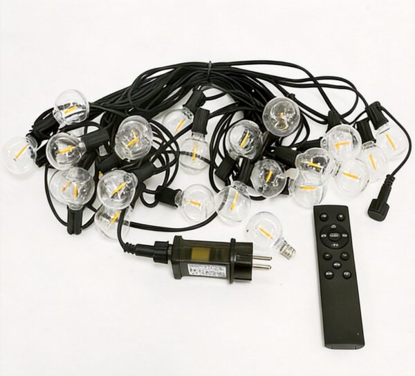 G40 LED String Lights Studio Product Photography Studio product photography of G40 LED dimmable string lights coiled with power plug, remote control, and warm glowing bulbs